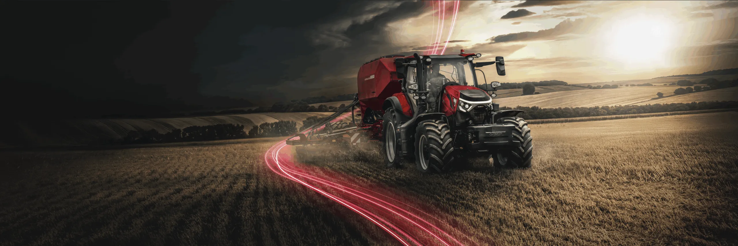 Nowoczesny ciągnik na żniwa Case IH i Steyr podczas pracy w polu